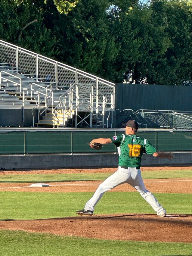 Dan Clemens winds up a fastball for the Marysville Drakes, located just north of Sacramento. The 55-year-old pitcher is the oldest to record a win in Pecos League history.